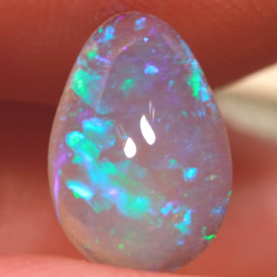 SOLID CRYSTAL OPAL Rolling flashes of green play in a 3D pattern 
